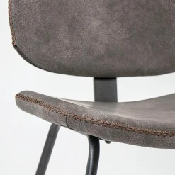 Straluma Bruine eetkamerstoel van imitatietleer met zwart onderstel></noscript> Eetkamerstoelen