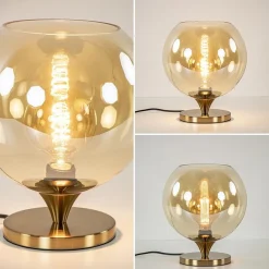 Straluma Elegante tafellamp donker goud met amber glazen bol 25 cm></noscript> Tafellampen|Luxe Verlichting