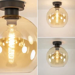 Straluma Mat zwarte plafondlamp met amber glazen bol><noscript><img width=
